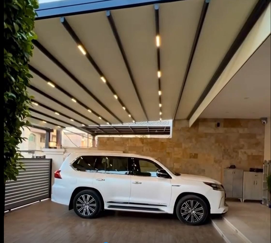 Retractable pergola over a residential carport